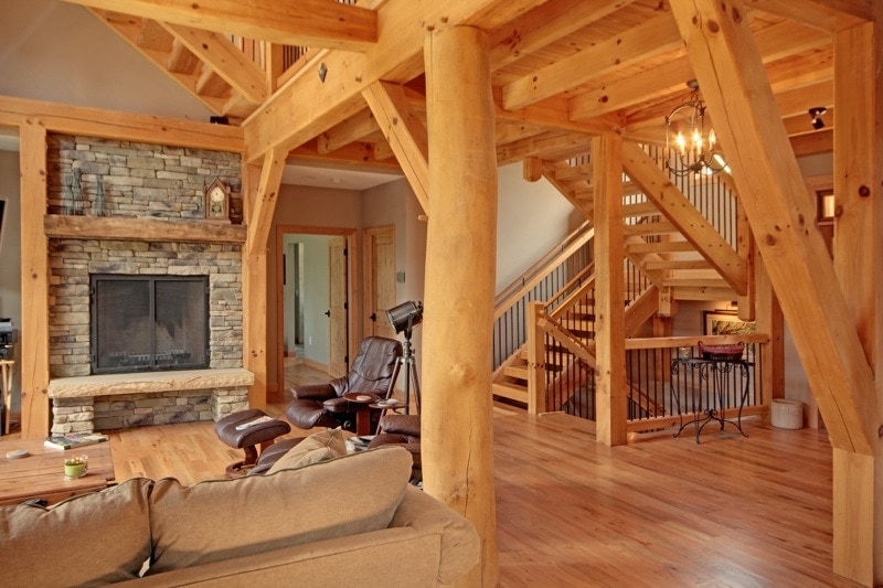 Timber Frame Great Room with Fireplace and Treeform Post