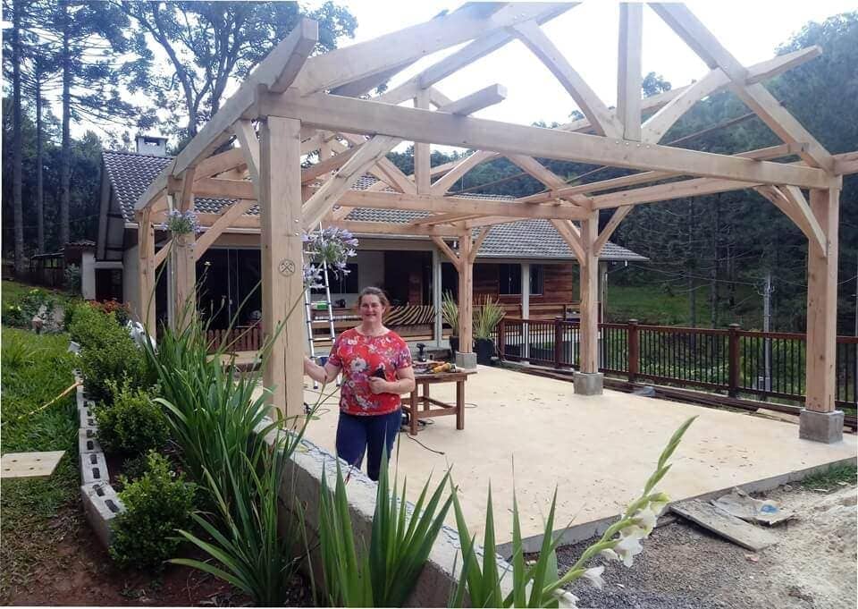 Timbered carport in front of home