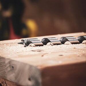 Rothoblaas Lewis ship auger bit drilling deep hole in timber with wood chips clearing from twist flute