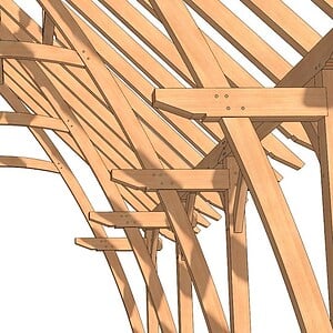 Interior view of 20x36 Cruck Timber Frame showing curved cruck blade arches and open span